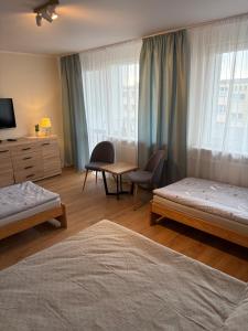 Ένα ή περισσότερα κρεβάτια σε δωμάτιο στο BlaBlaFlat Świnoujście Grunwaldzka