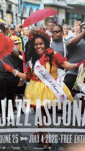 a poster of a woman in a crowd of people at Appartamento Ascona , rooftop terrace apartment in Ascona