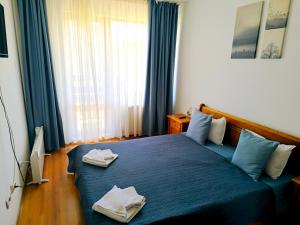 Ένα ή περισσότερα κρεβάτια σε δωμάτιο στο Apartment in Belvedere Club G205 +14 φωτογραφίες