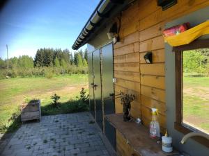 a view from the outside of a house with a window at Kemping przy Suntago in Lublinów