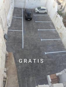 a car parked in a parking lot with the words grains at Apartamento centro ciudad patio cuarenta 2A in Algeciras +1 photo