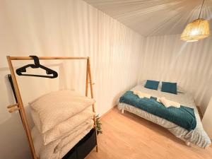 Postel nebo postele na pokoji v ubytování Séjour cosy près de Strasbourg avec parking