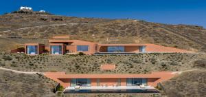 a house on top of a hill at Olen Syros in Megas Yialos-Nites