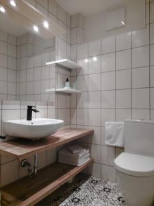 a bathroom with a sink and a toilet at Apartment Nähe Wolfgangsee Salzkammergut in Strobl +36 photos