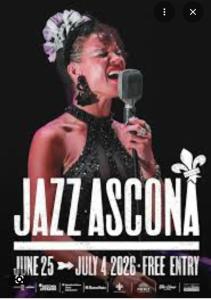 a woman singing into a microphone on a stage at Appartamento Ascona , rooftop terrace apartment in Ascona