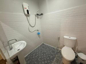 a bathroom with a shower and a toilet and a sink at Diamond House in Srithanu in Srithanu