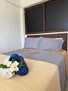 Ένα ή περισσότερα κρεβάτια σε δωμάτιο στο MHV Milagres - Studio Guadalupe 11 +31 φωτογραφίες