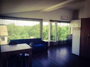 a living room with a couch and a table at BSG Rustaveli 184 in Kobuleti