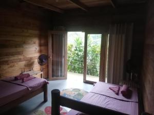 Postel nebo postele na pokoji v ubytování casa colibri cañón de rio dulce + 10 fotografií