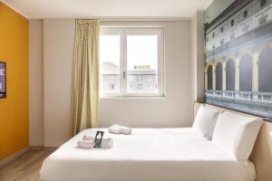 Ένα ή περισσότερα κρεβάτια σε δωμάτιο στο B&B Hotel Roma Fiumicino Aeroporto Fiera 2 +22 φωτογραφίες