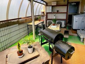 an inside view of a house with a gun at 九十九里シーサイドヴィラ in Tōganemachi