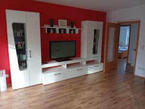 Телевизор и/или развлекательный центр в Ferienwohnung Margit am Park