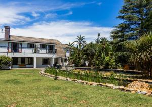 an exterior view of a house with a yard at House 1967 in George