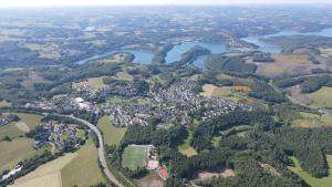 an aerial view of a city and a river at Chalet am Biggesee in Olpe