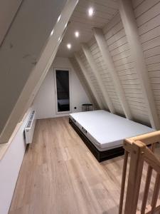 Ένα ή περισσότερα κρεβάτια σε δωμάτιο στο Chalet am Biggesee