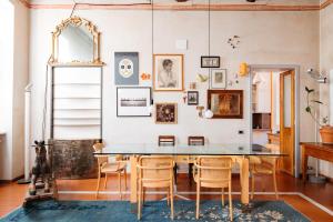 a dining room with a table and chairs at Carlo Alberto CHARM & TERRACE in Turin
