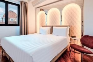 Кровать или кровати в номере B&B Hotel Firenze Laurus Al Duomo