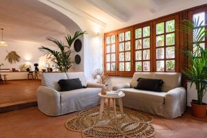 a living room with two couches and a table at B&B HOTEL Ischia San Nicola in Ischia