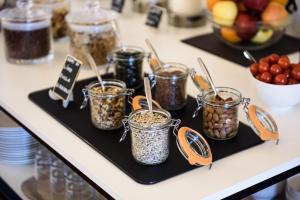 a group of jars of food on a counter at B&B HOTEL Ischia San Nicola in Ischia