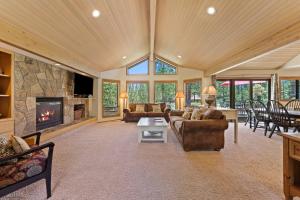 a large living room with couches and a fireplace at 10 Tan Oak in Sunriver