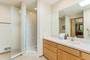 a bathroom with a sink and a shower at 10 Tan Oak in Sunriver +31 photos