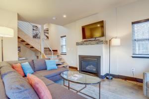 a living room with a couch and a fireplace at Urban Roundabout in Bend