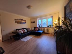 a living room with a couch and a window at Sea nest in Jūrmala