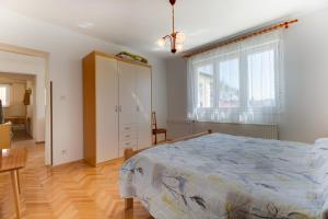 Postel nebo postele na pokoji v ubytování Apartmani Dorita