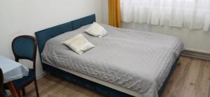 Ένα ή περισσότερα κρεβάτια σε δωμάτιο στο Cichy Zaułek 9A