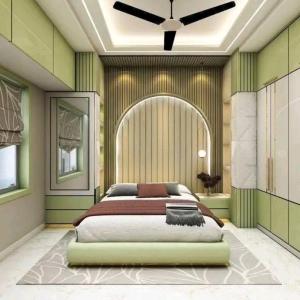 a bedroom with a large bed with a ceiling fan at Accomodation bnb lodge hotel guest house airbnbs in Ruiru