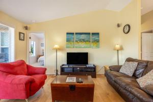 a living room with a couch and a tv at River Ranch in Hood River
