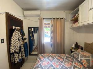 Кровать или кровати в номере Casa de praia da Gi em Gravatá Navegantes a 7km do Beto Carrero e perto da praia