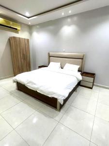 Ένα ή περισσότερα κρεβάτια σε δωμάτιο στο شاليهات الفخامة