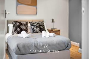 Giường trong phòng chung tại Spacious 5BR Home - Sleeps 9 - Twickenham Rugby - Parking +21 ảnh