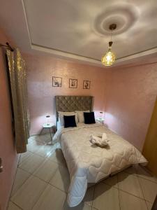 a bedroom with a large bed in a room at Appartement saada Agadir in Agadir