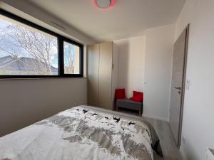 Giường trong phòng chung tại La chambre des amis