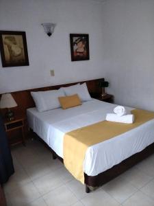 Ένα ή περισσότερα κρεβάτια σε δωμάτιο στο Hotel Balcones De Malibu