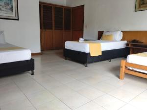 Ένα ή περισσότερα κρεβάτια σε δωμάτιο στο Hotel Balcones De Malibu +19 φωτογραφίες