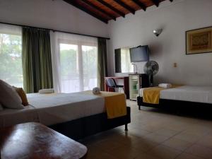 Postel nebo postele na pokoji v ubytování Hotel Balcones De Malibu