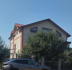 a car parked in front of a house at Calin in Surlari