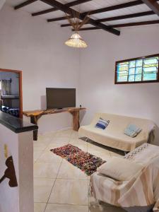 Μια τηλεόραση ή/και κέντρο ψυχαγωγίας στο Suítes Arraial 300m do Centro