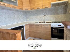 a kitchen with a sink and a stove at Appartamento vacanze Marco in Venas