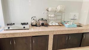 Η κουζίνα ή μικρή κουζίνα στο Himalayan Laligurans Apartments