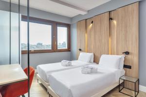 Ένα ή περισσότερα κρεβάτια σε δωμάτιο στο B&B Hotel Milano City Center Duomo