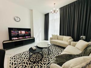 a living room with a couch and a table at Executive 1BR - Perfect for DIFC & Trade Center in Dubai