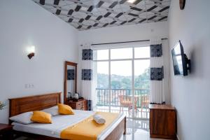 Ένα ή περισσότερα κρεβάτια σε δωμάτιο στο Medhani