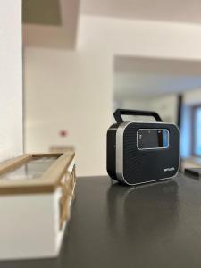 a toaster sitting on a counter next to a box at Apartman Stone Garden in Mostar
