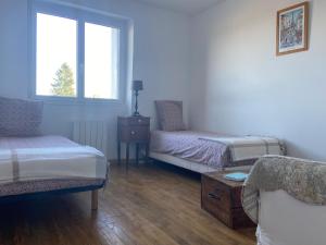 Ένα ή περισσότερα κρεβάτια σε δωμάτιο στο HORTENSE