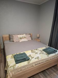 Postel nebo postele na pokoji v ubytování Dārza Studija