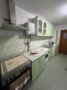 Η κουζίνα ή μικρή κουζίνα στο Apartament Comfort +4 φωτογραφίες